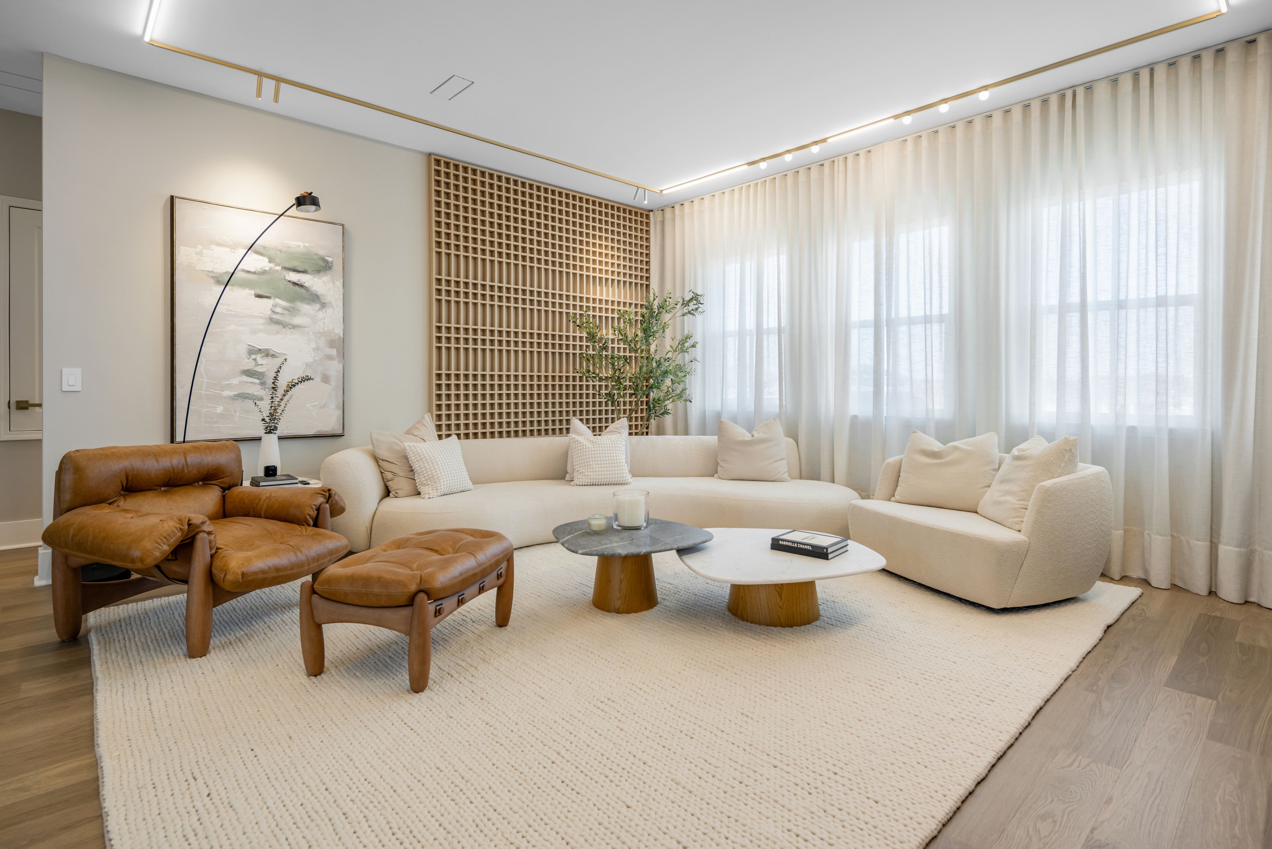 Floor-to-ceiling sheer drapery filtering daylight