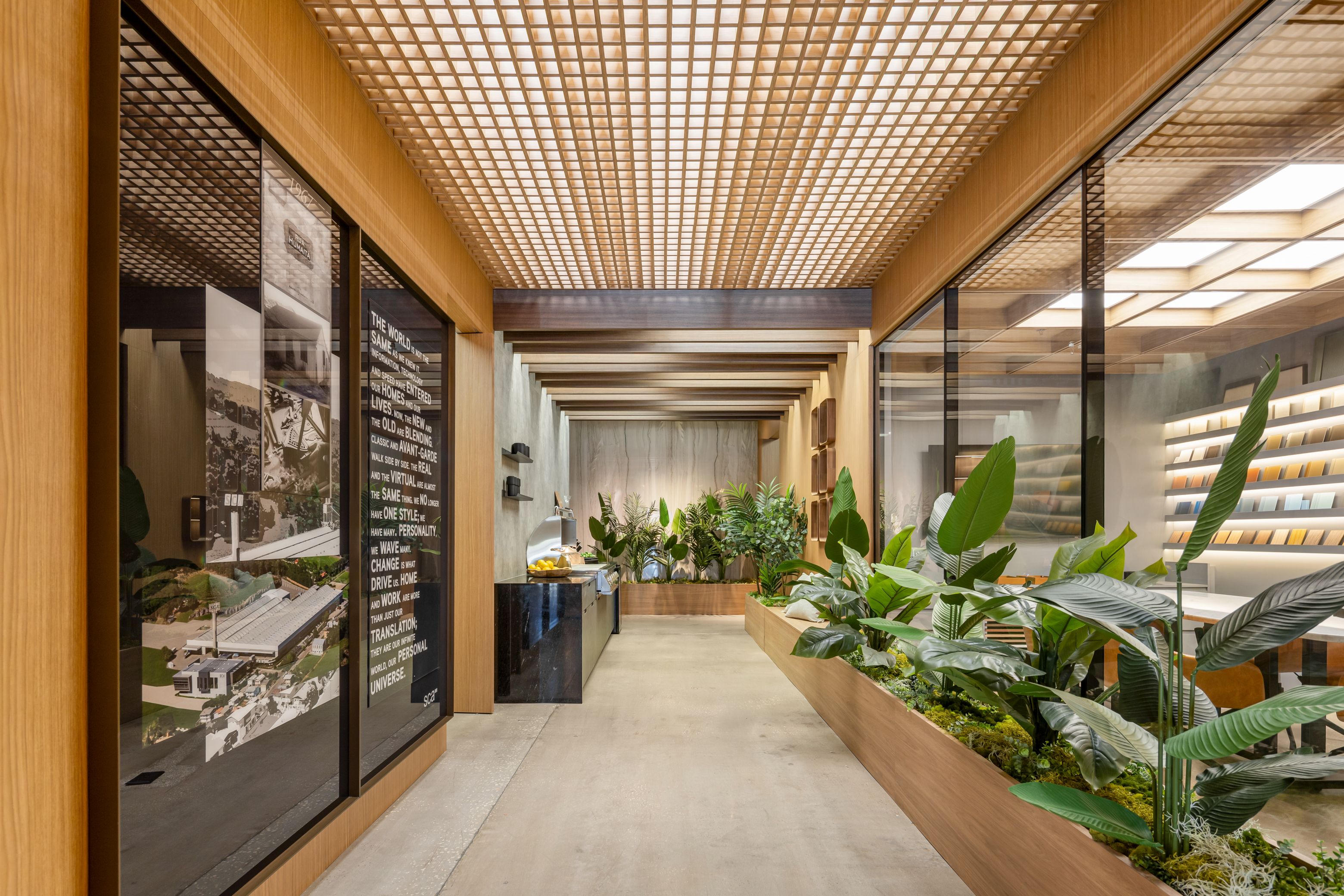 Showroom corridor under a backlit lattice ceiling